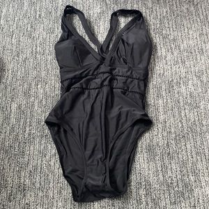 Black one piece with mesh cutouts